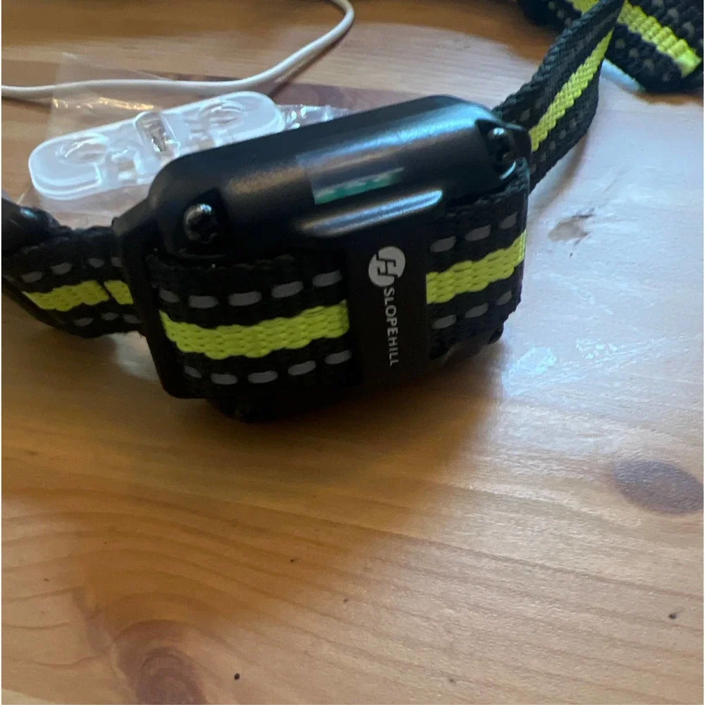 Dog obedience collar shock vibration sound shock turn off button.